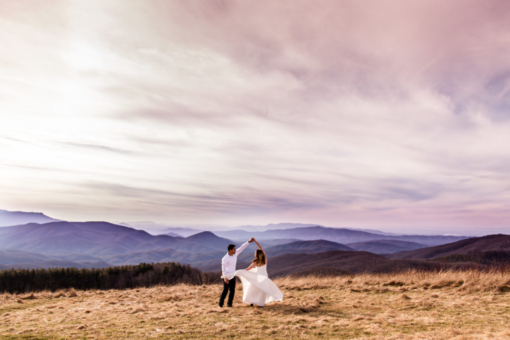 Bride and Groom Dancing on with mountains in the backdrop